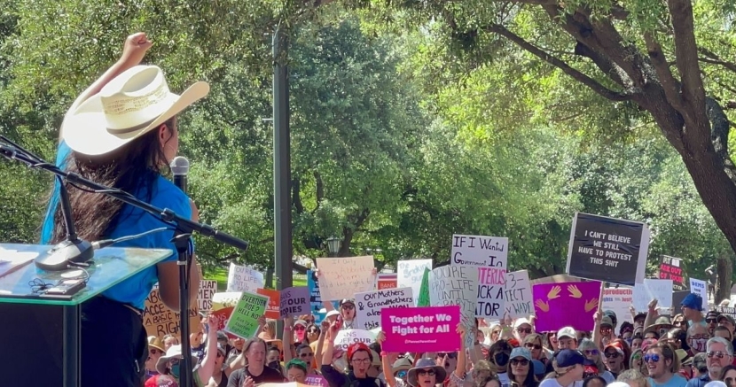 Photo of speaker and crowd at abortion rally