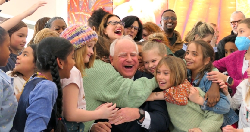 Tim Walz signing a bill into Minnesota law that would provide free breakfasts and lunches to students. 