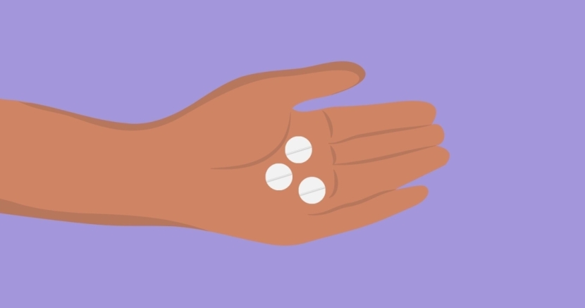 Hand holding abortion pills 