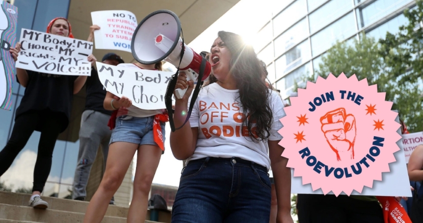 Diana Gomez speaking into a megaphone