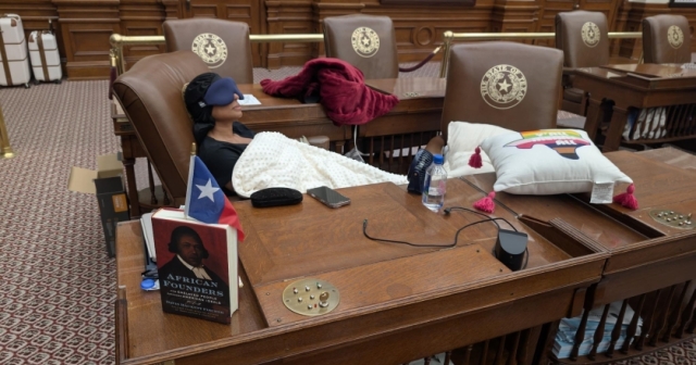 Democratic Texas Rep. Nicole Collier from Fort Worth sleeps at her desk on the Texas House floor on August 18, 2025. 